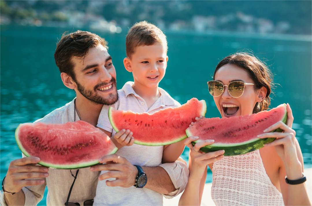 Family Enjoying Fresh Watermelon Outdoors | Glucoracy
